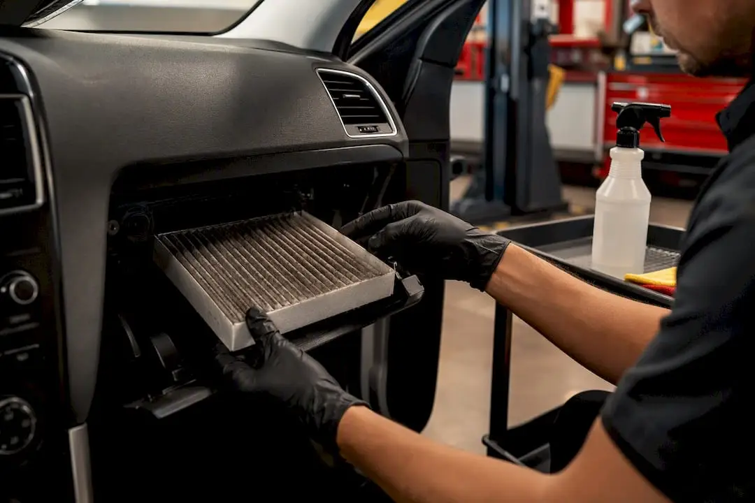 Technician replacing a cabin air filter